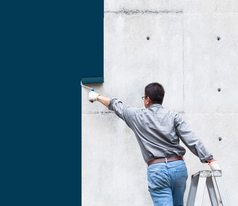 A craftsperson painting a wall blue, representing Appnexio's hands-on approach